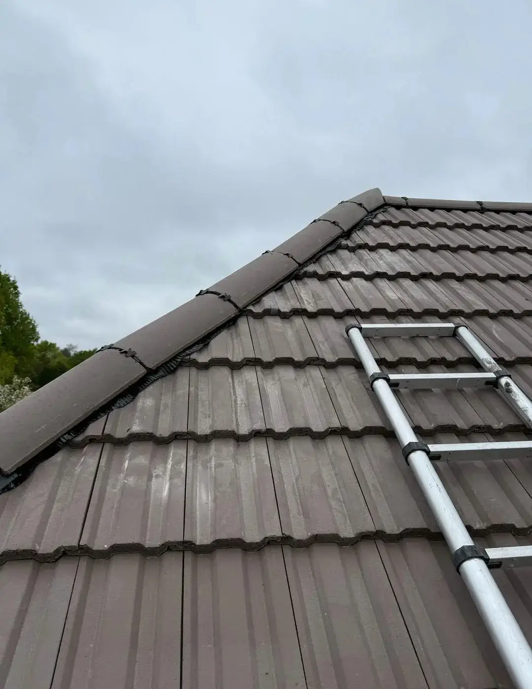 Emergency roofing repair by A-List Roofing on a storm-damaged roof in Surrey