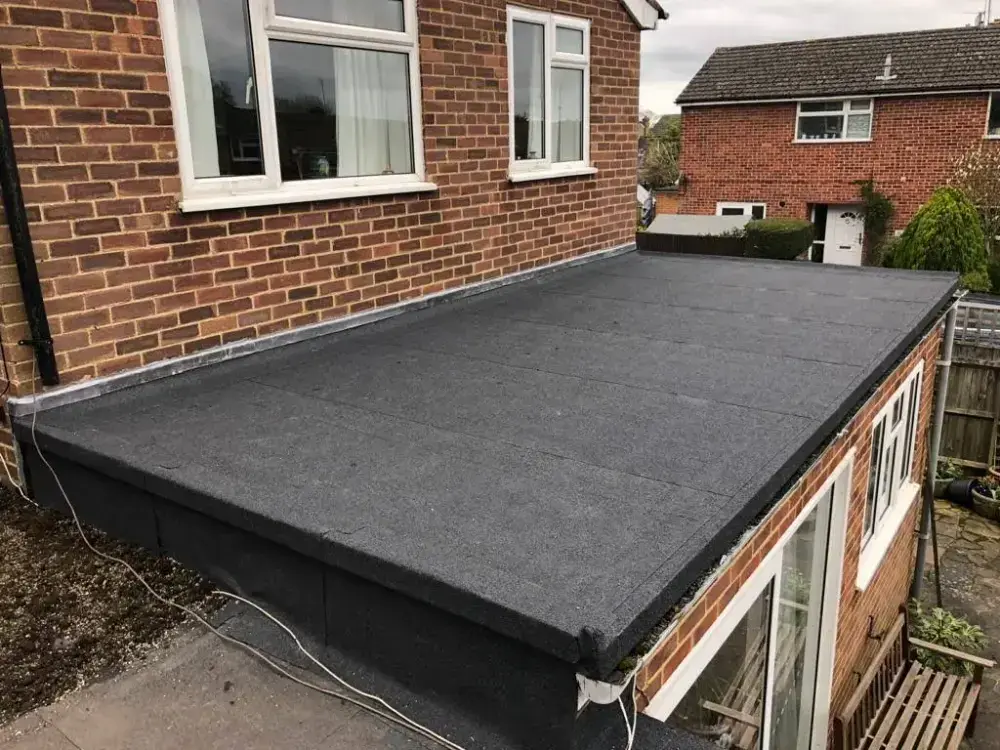 The same extension roof after A-List Roofing installed a new felt flat roof system