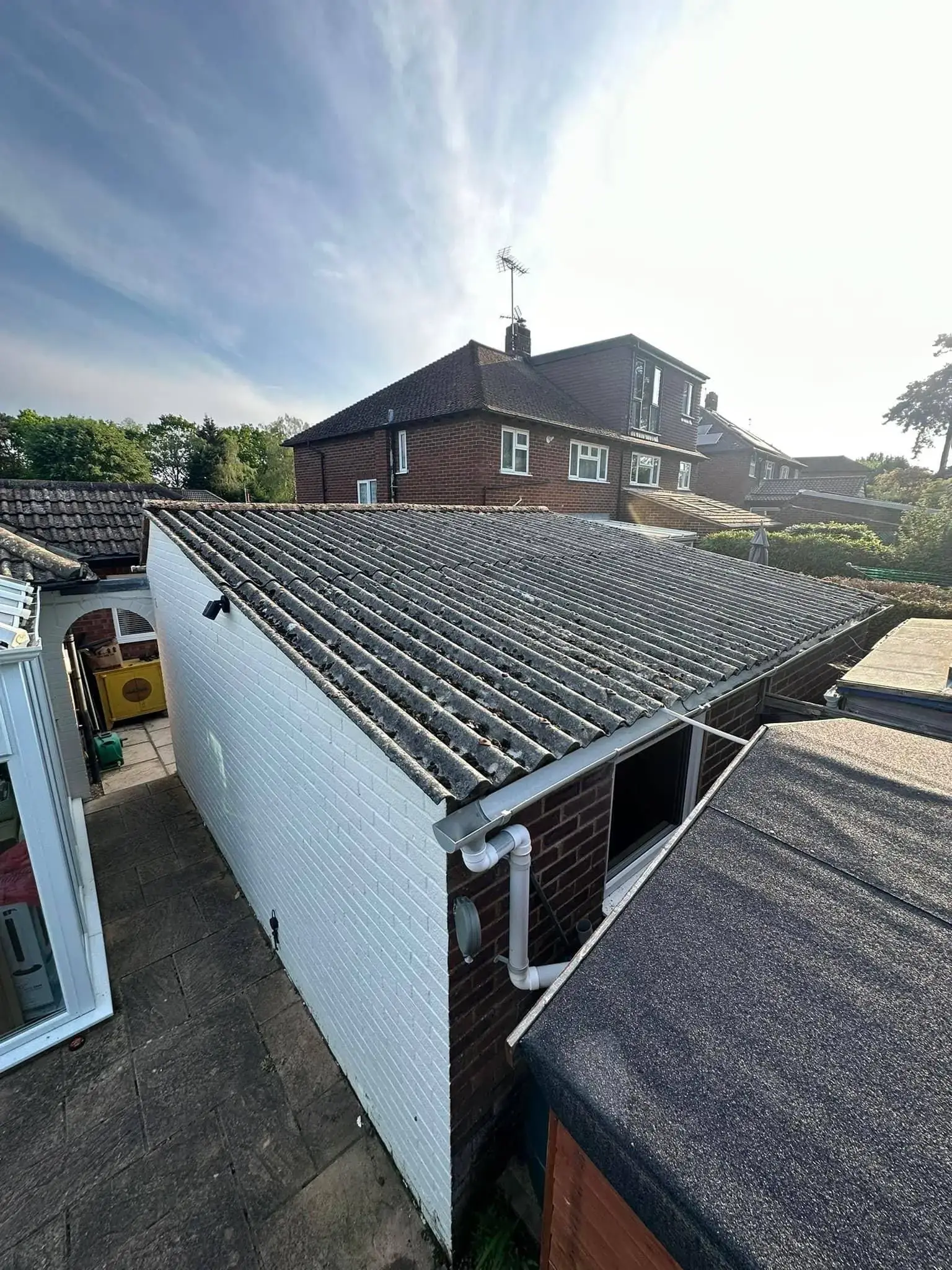 Garage roof replacement by A-List Roofing — the old corrugated roof