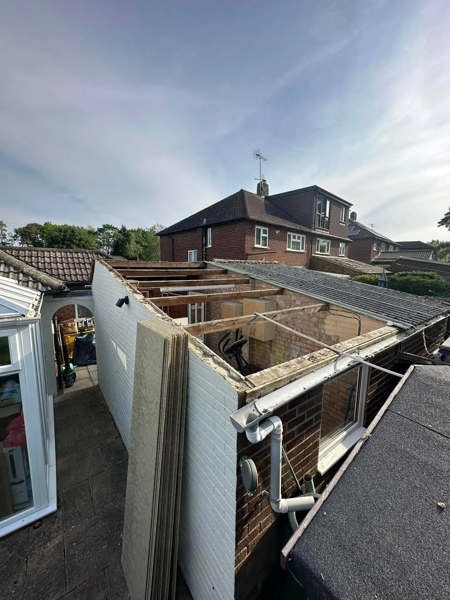 Garage roof replacement by A-List Roofing — stripping it off